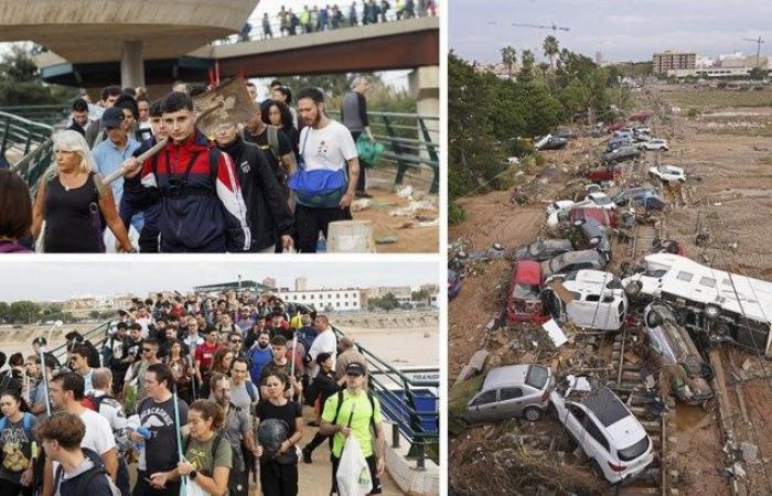 Hundreds of volunteers walk kilometers from Valencia to hardest-hit areas armed with brushes and buckets