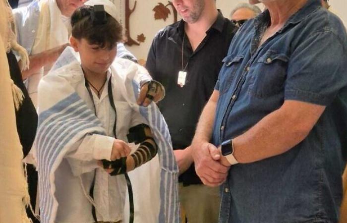 Ex-hostage Erez Calderon makes his bar mitzvah without his father Ofer, still hostage