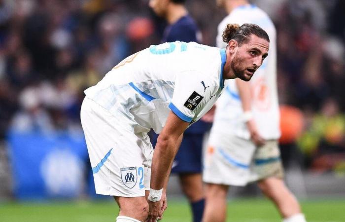 Adrien Rabiot pushes a player away from OM