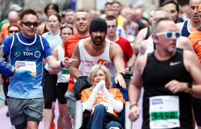 Colin Farrell finishes marathon while pushing friend in wheelchair