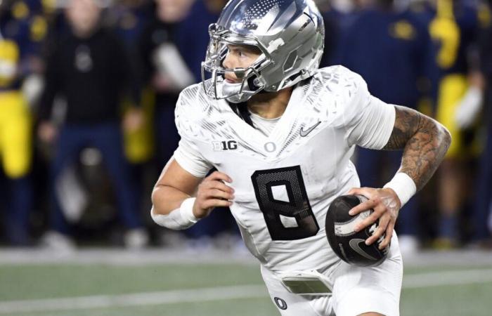 Dillon Gabriel throws a TD pass and runs for a score to lead No. 1 Oregon to 38-17 win over Michigan