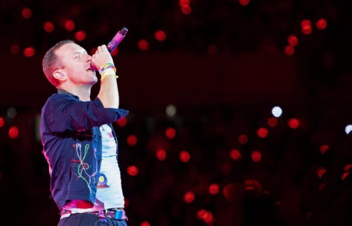 Coldplay singer Chris Martin falls through a trap door during a concert