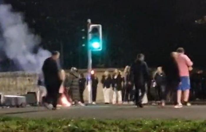 Riot cops clash with firework yobs and police chopper called in as gangs torch bins & launch bottles