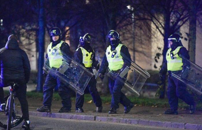 Riot cops clash with firework yobs and police chopper called in as gangs torch bins & launch bottles