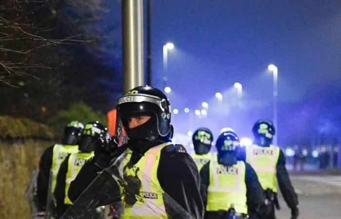 Riot cops clash with firework yobs and police chopper called in as gangs torch bins & launch bottles