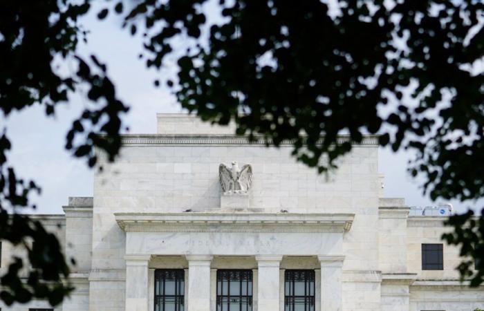 Fed cuts rates, notes job market easing and solid economic growth