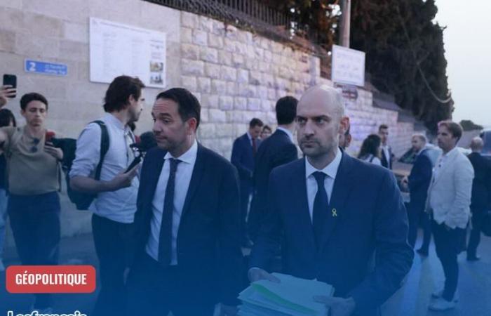 Two gendarmes put on the ground in a place administered by France