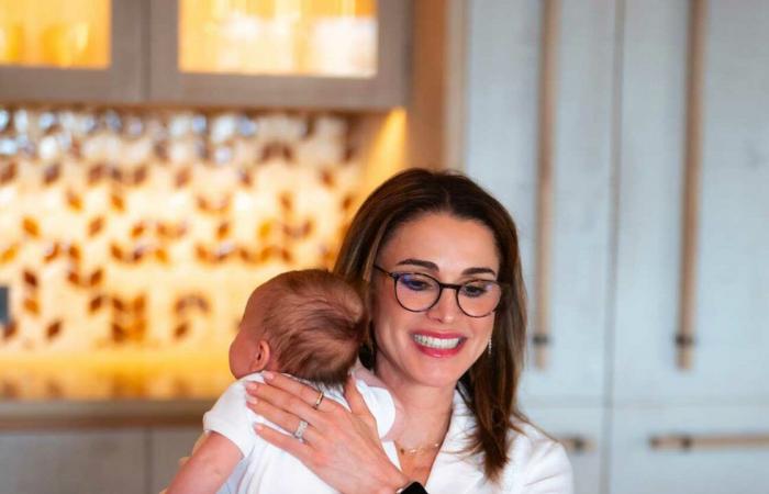 Queen Rania teleworks with her granddaughter Iman in her arms