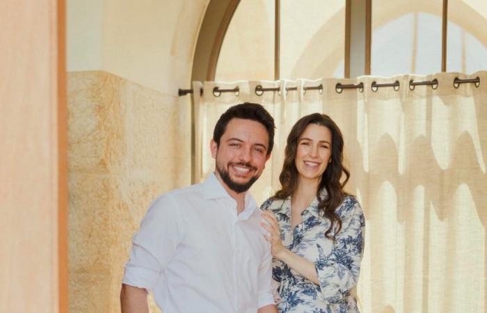 Queen Rania teleworks with her granddaughter Iman in her arms