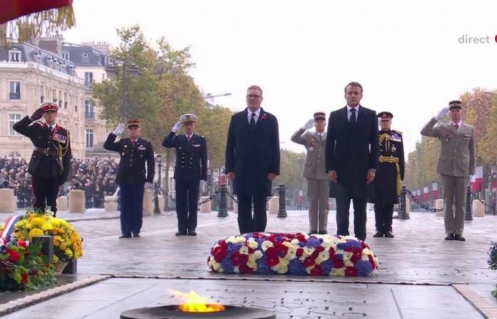 Emmanuel Macron and the British Prime Minister rekindled the Flame of Remembrance under the Arc de Triomphe