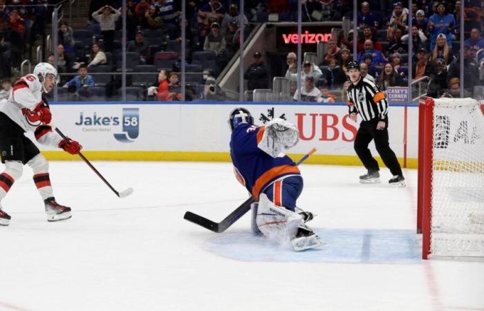 Isles blow two-goal third-period lead, lose to Devils in OT