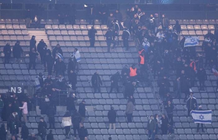 a fight breaks out in the stands during the match, dozens of people involved