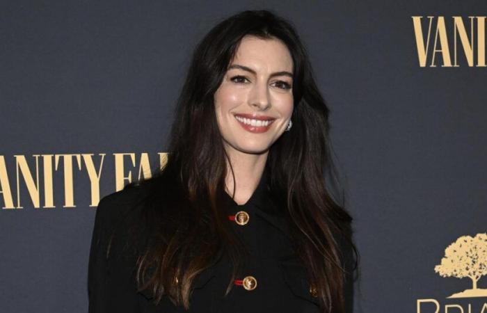 Anne Hathaway and her son almost get hit by a player during a basketball game