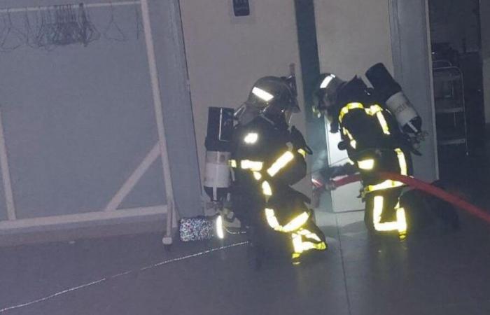 To train, firefighters simulate a fire in the Grandcourt village hall