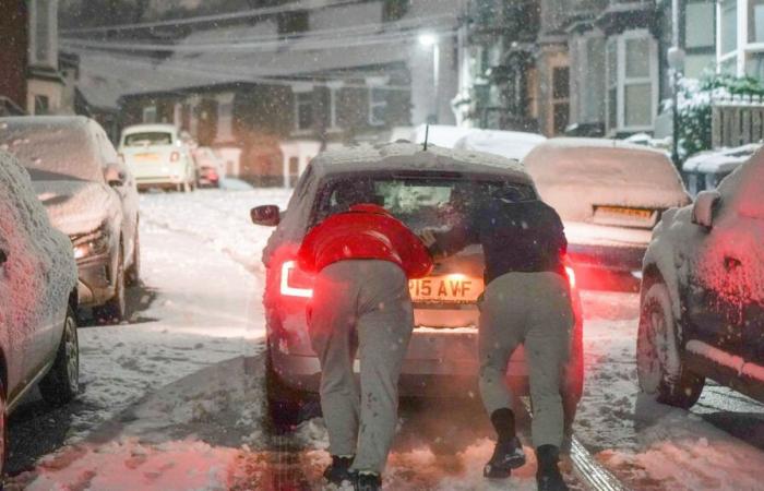 Schools close & Brits battle sheets of snow as temps plunge to -8C with further 8 inches to fall causing travel carnage