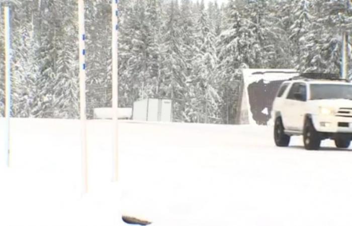 Drivers chain up to travel Cascades passes amid snowstorm warning