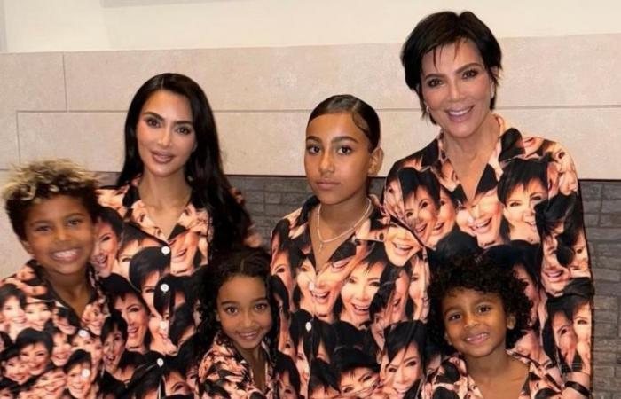 Kim Kardashian poses with her 4 children