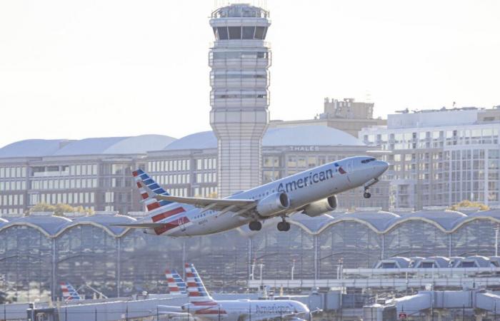 A passenger tries to open the door of a plane in mid-flight, the other passengers duct tape him