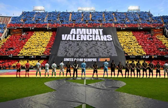 emotion in Valencia which pays tribute to flood victims with a victory