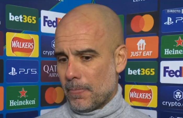 Guardiola appears with his head and nose full of scratches!