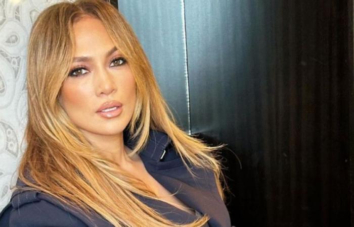 In a microskirt and thigh-high boots, Jennifer Lopez exposes her legs, her features smoother than ever