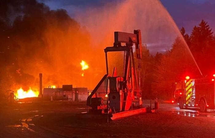 Explosive Chaos: Tanks at the General Motors Proving Ground ignite in a fire, houses shaken by the explosion.