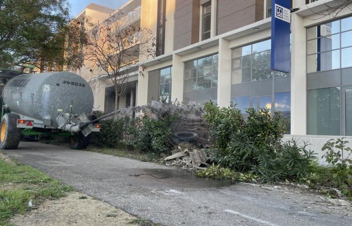 hay dumped in front of Grand Frais