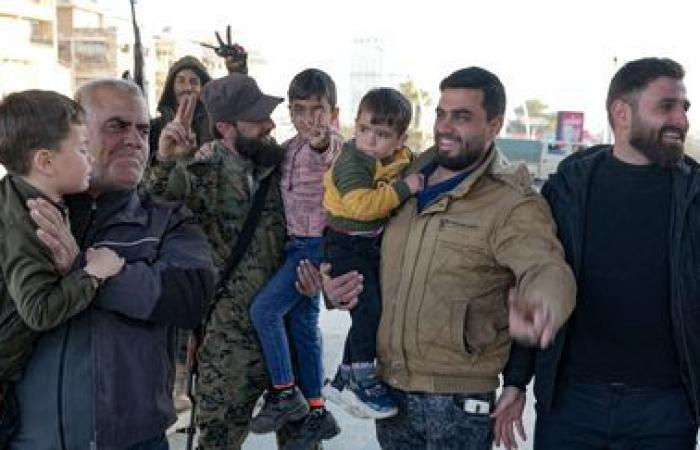 families celebrate their return to Aleppo, Syria's second city that fell into the hands of rebels and jihadists