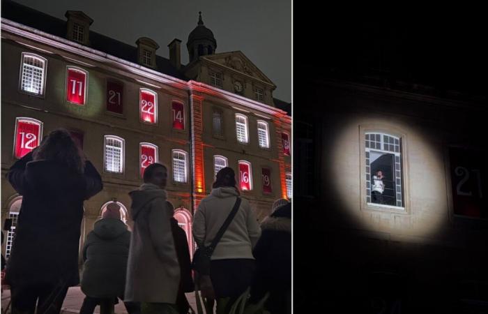 he comes out of the town hall’s giant Advent calendar