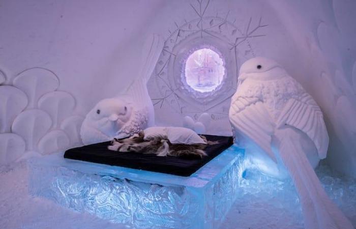 A local sculptor works on the most prestigious ice hotel