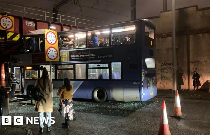 Eight injured after bus roof torn off in Glasgow railway bridge crash