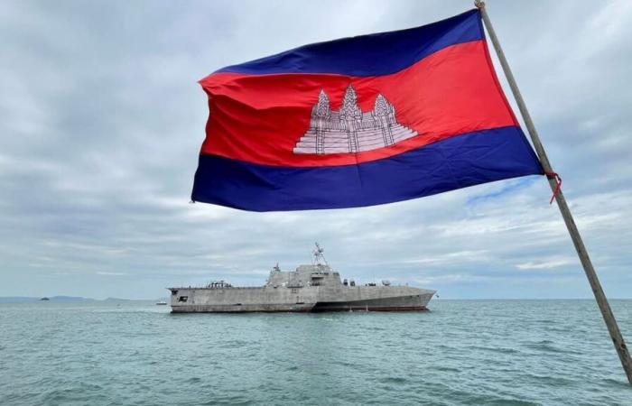 A US warship docks in Cambodia, near a base renovated by Beijing