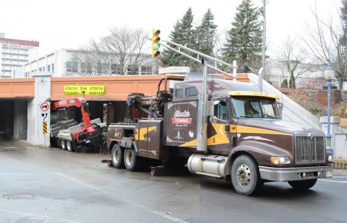 another truck stuck under the viaduct