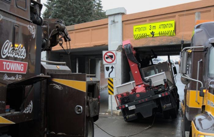 another truck stuck under the viaduct