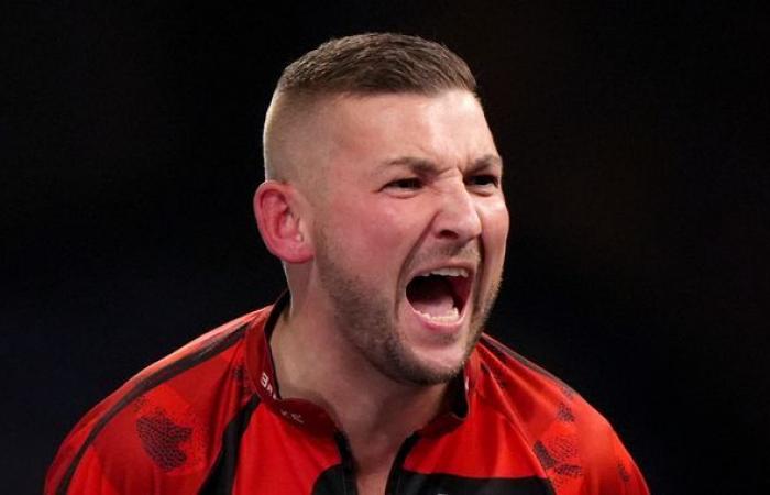 World Darts Championship: Nathan Aspinall earns nervy win as Christian Kist hits nine-darter in defeat