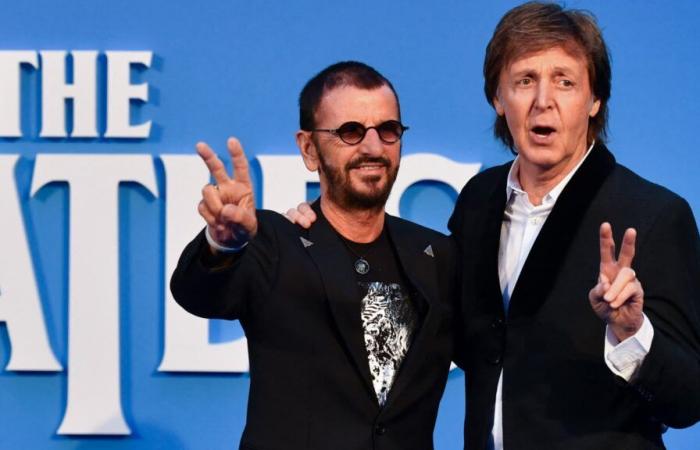 Paul McCartney joined by Ringo Starr on stage during a concert in London