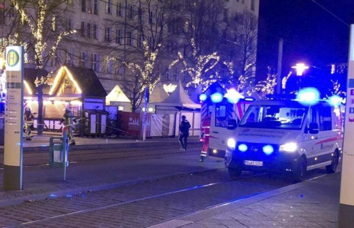 Germany, cars against the crowd at the Magdeburg Christmas market