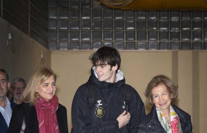 Queen Sofia tenderly encourages her grandson Pablo during his handball match