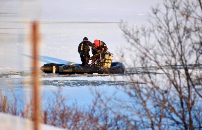 Snowmobiler father dies in river