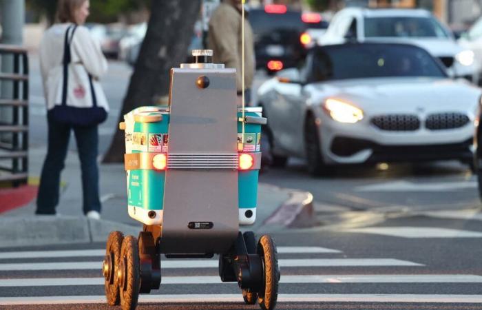 a food delivery robot was hit by a robot taxi