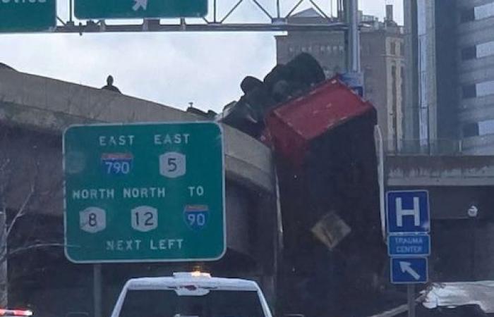 Utica declares snow emergency; dump truck rolls over highway ramp