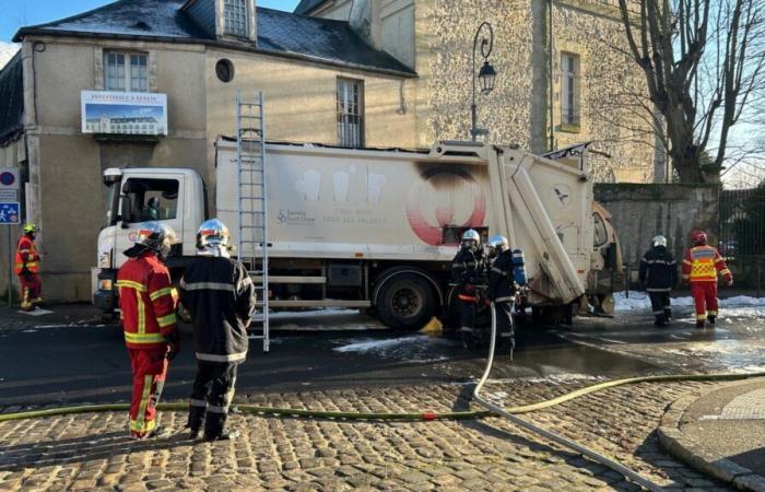 In Senlis, the contents of a garbage truck catches fire and blocks all traffic in the city center