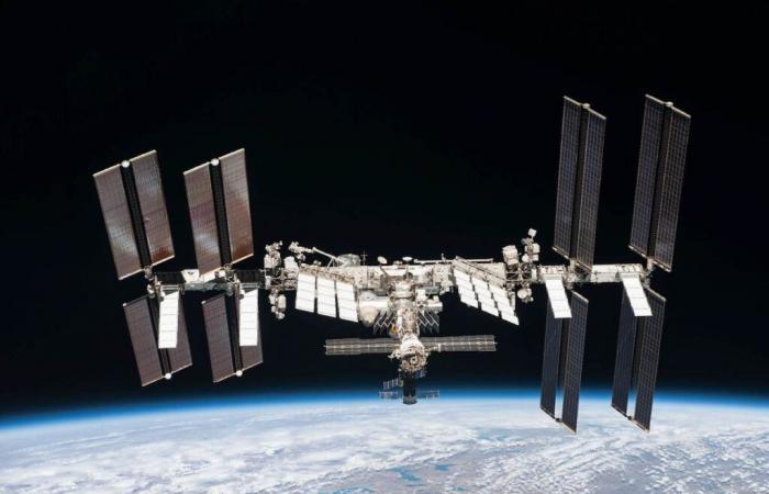 How does the International Space Station orbit Earth without disintegrating?