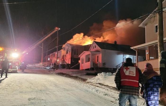 Ten people on the street following a fire in an apartment building in Edmundston