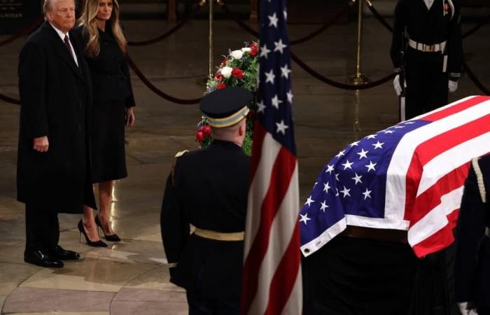 Donald Trump pays tribute to the president’s coffin before national mourning