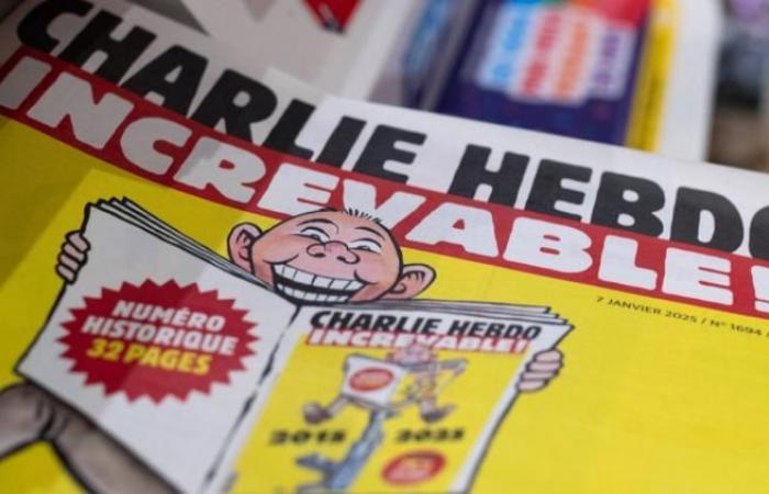 front pages of Charlie Hebdo torn from the walls of a restaurant