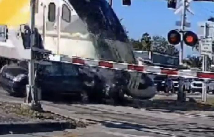 A train sends an optimistic Prius into the scenery