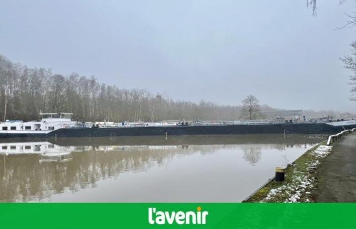 At the Mornimont lock, a barge across the Sambre blocks river traffic