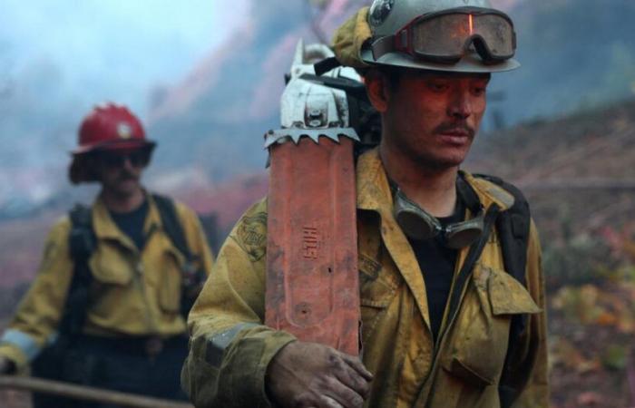 In Los Angeles, homeowners call on private firefighters to protect their homes from flames