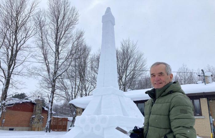 Jean-Marie Laliberté sculpts the Eiffel Tower and its Olympic rings from snow